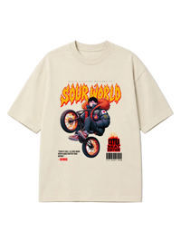 Beige t-shirt with a graphic design of a character on a motorcycle and text on a white background